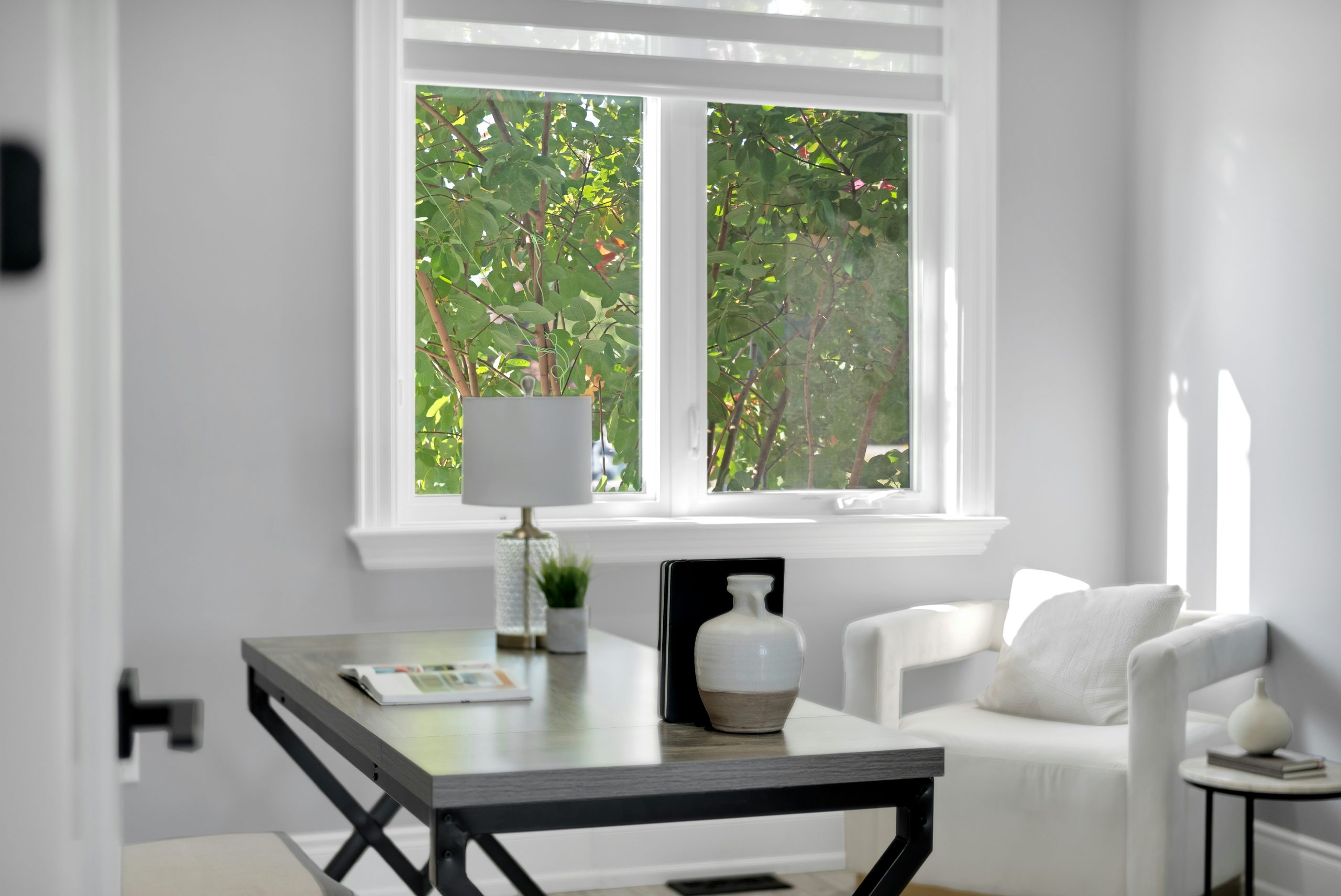 Bright compact apartment workspace with a desk and natural light